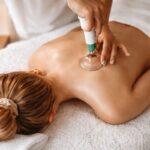 Therapist performing cupping therapy