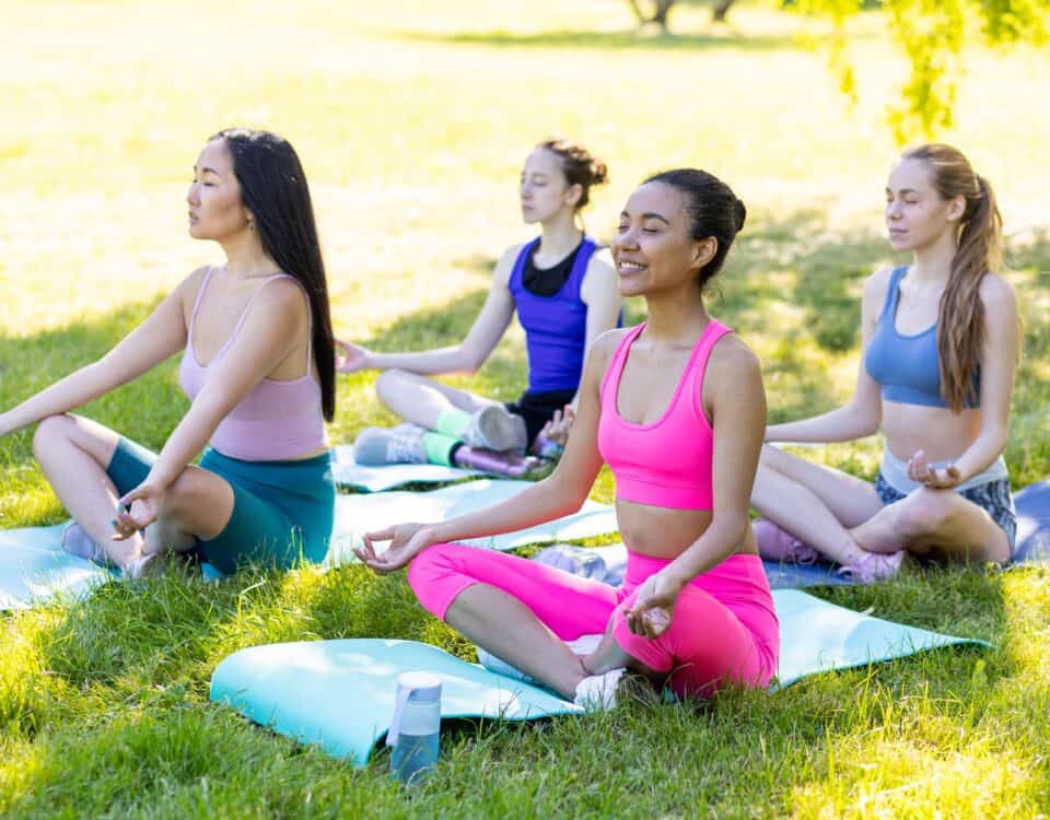 women practicing yoga